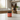 Jar of Turmeric Wellness+ supplement for dogs from North Hound Life on a kitchen counter with a dog sitting in the background
